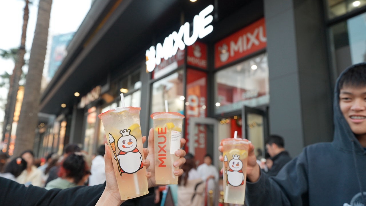 MIXUE's signature soft serve and fresh tea beverages displayed with high quality ingredients